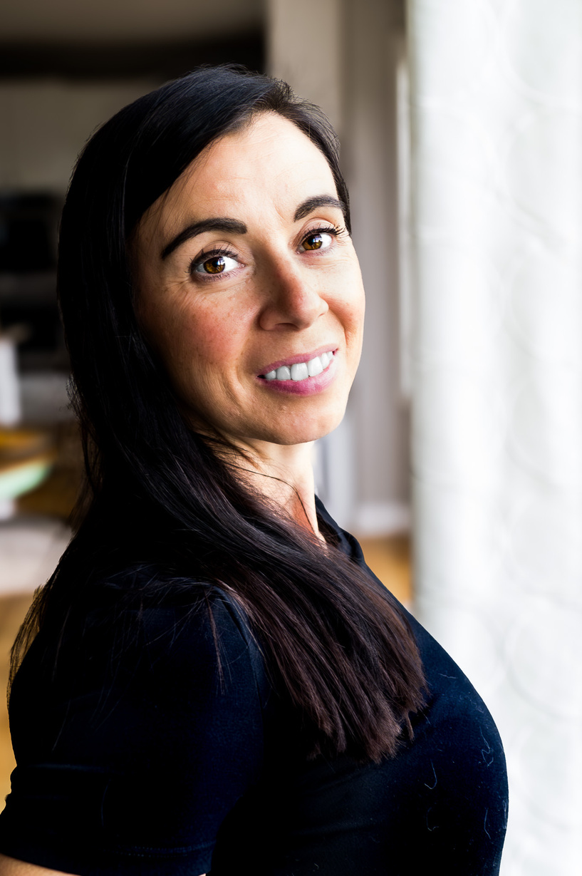 a person with long dark hair and a black shirt