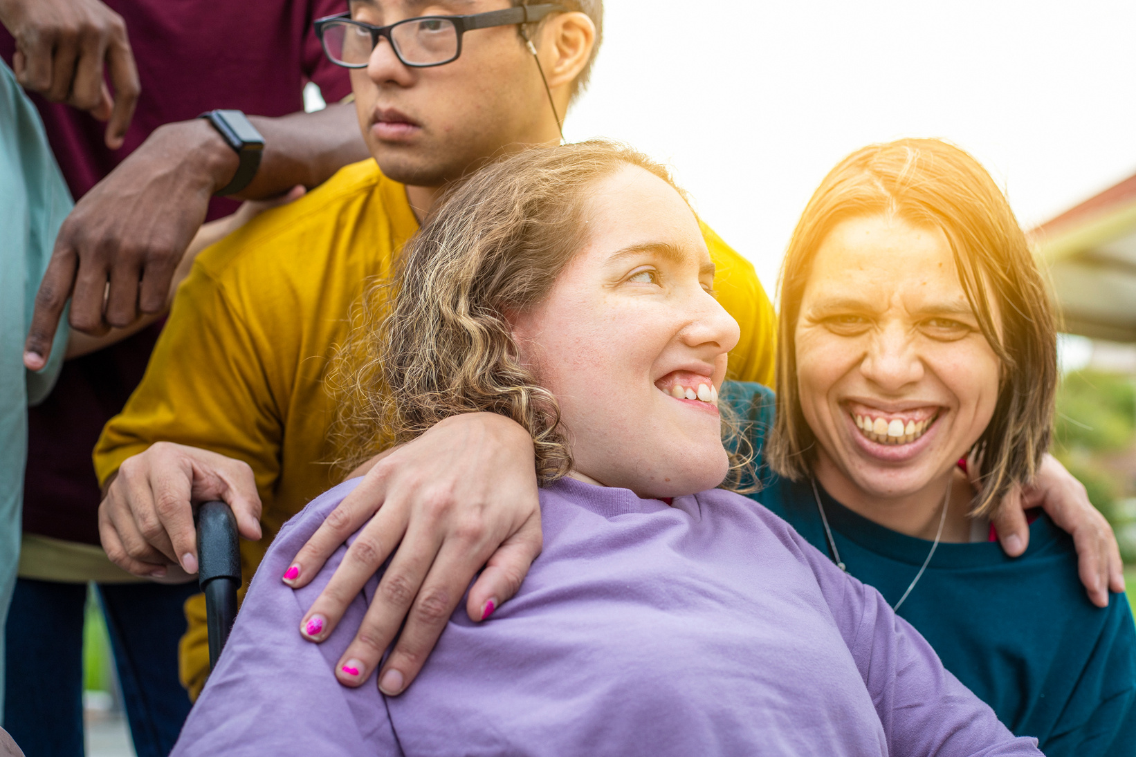 a group of people are smiling and laughing together