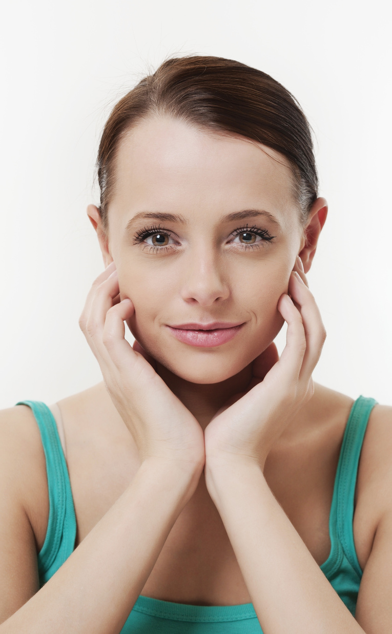 a person posing with their hands on their face