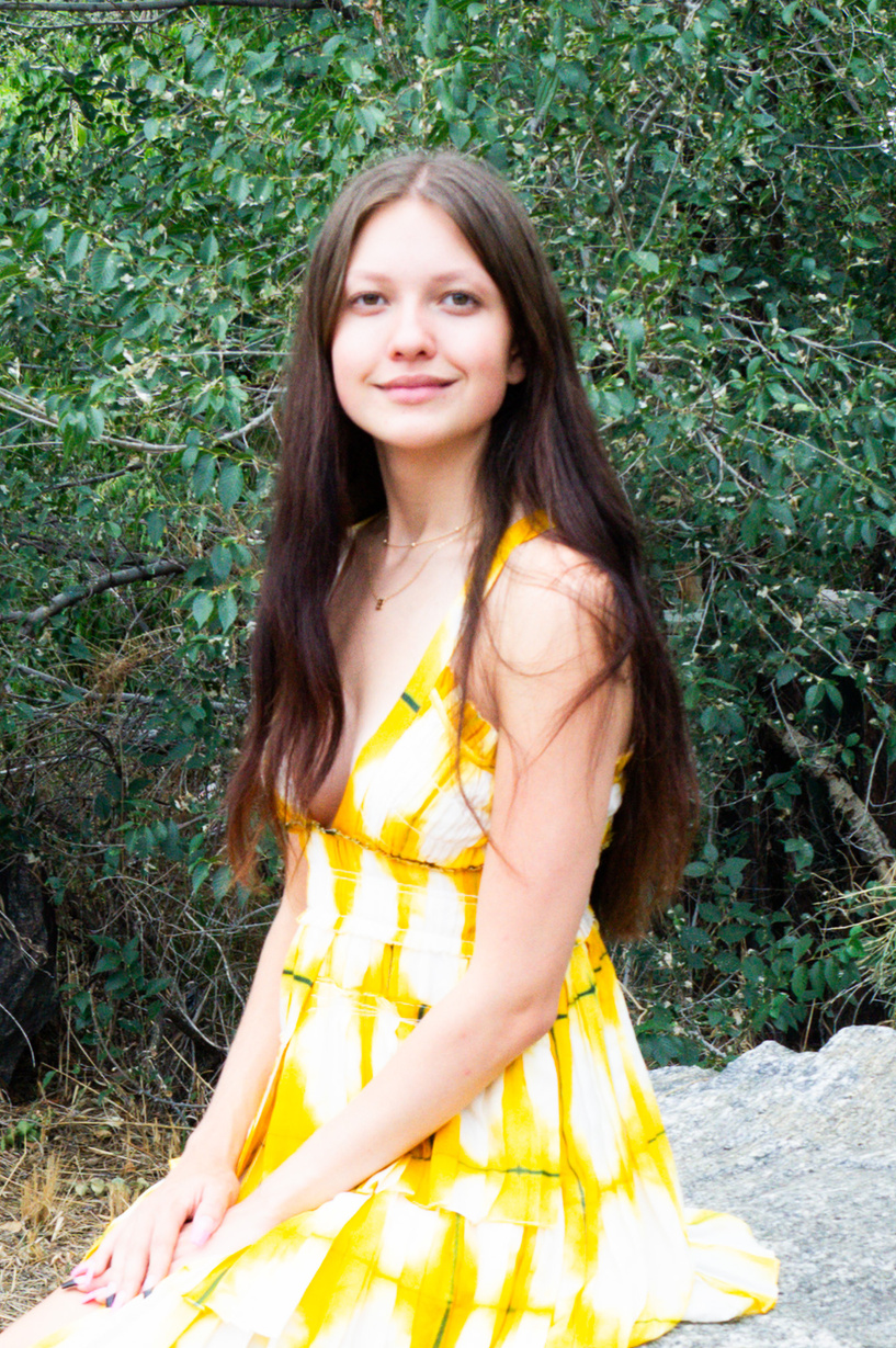 a person in a yellow and white striped dress