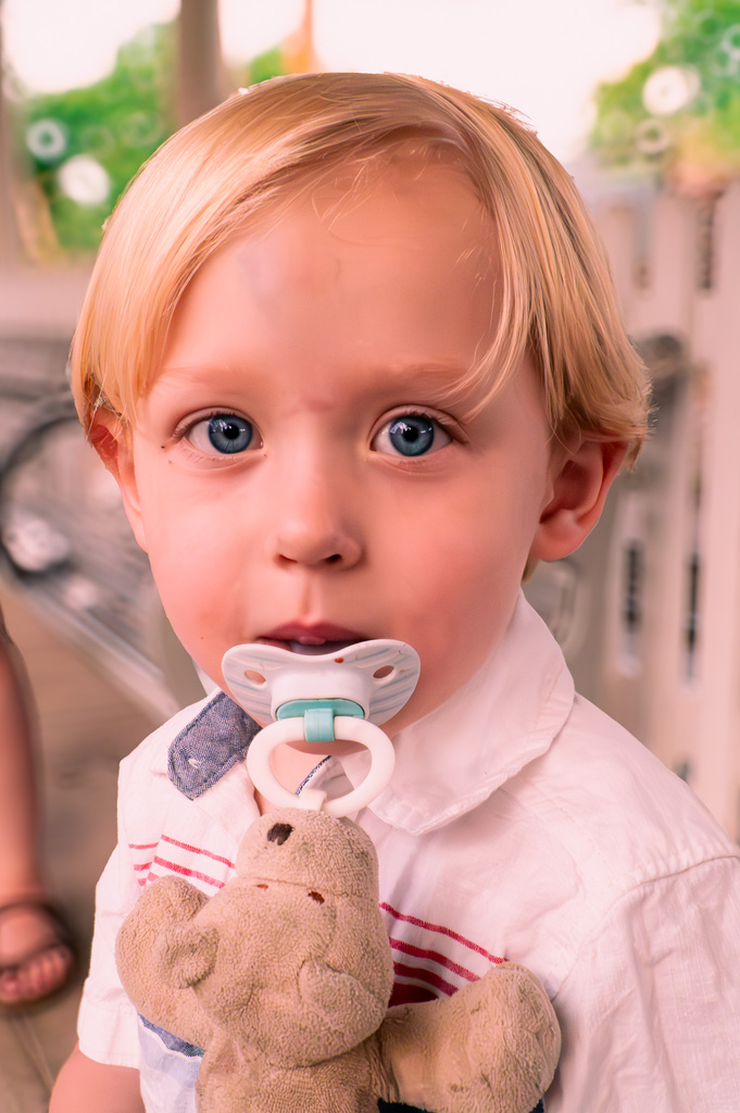 a child with a pacifier in their mouth