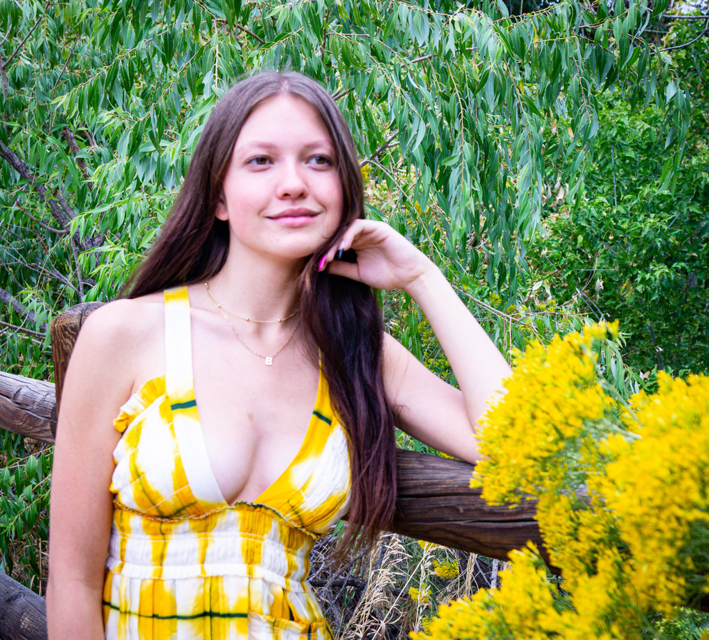 a beautiful person in a yellow and white dress