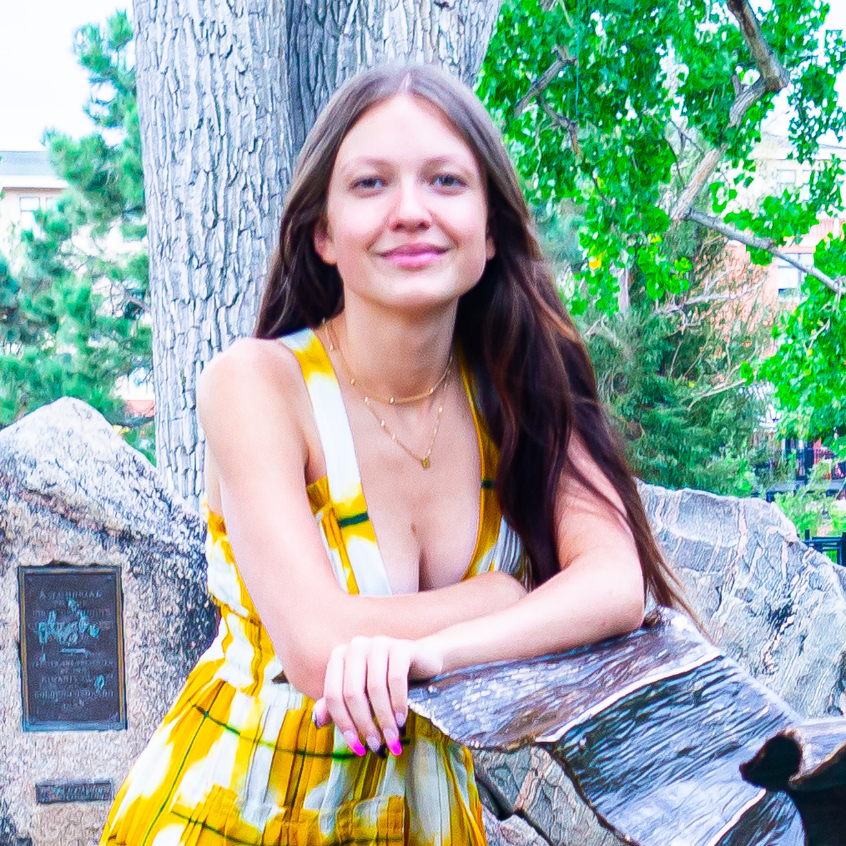 a beautiful person in a yellow and white dress